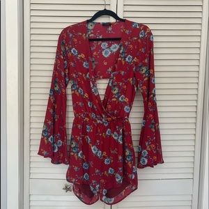 Low cut, open back, long sleeve romper